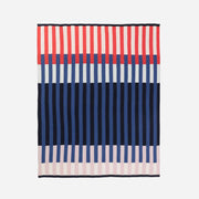 Striped fabric with red, blue, and pink horizontal stripes on a white background