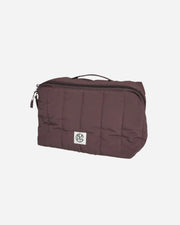 Brown toiletry bag with a visible brand logo on a light gray background