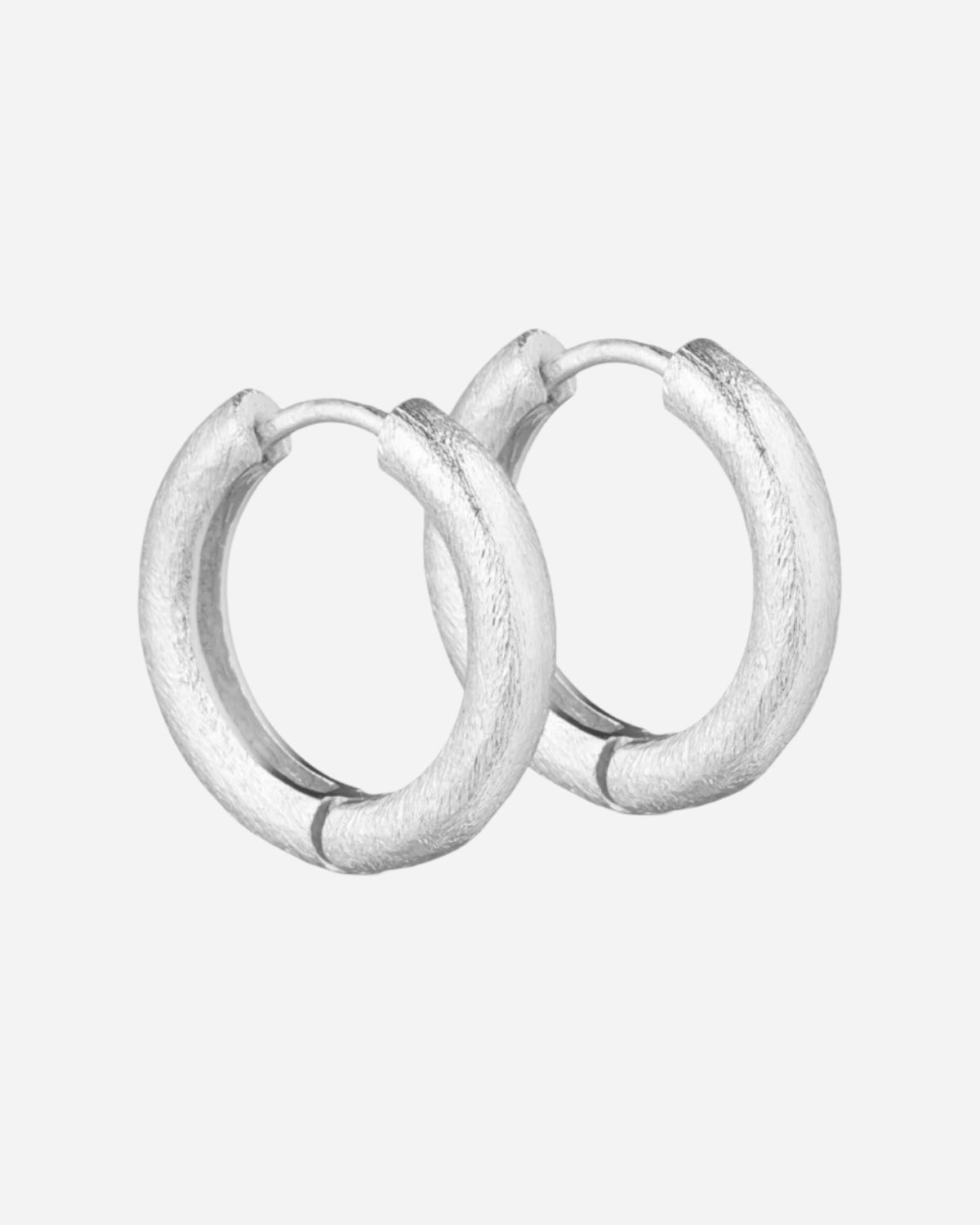 Pair of silver hoop earrings on a white background