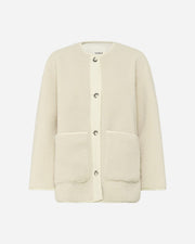 Cream boucle jacket with button details on a white background