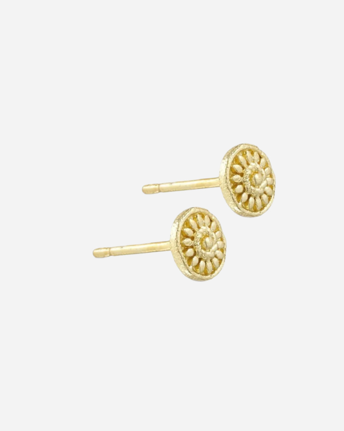 Gold earrings on a white background