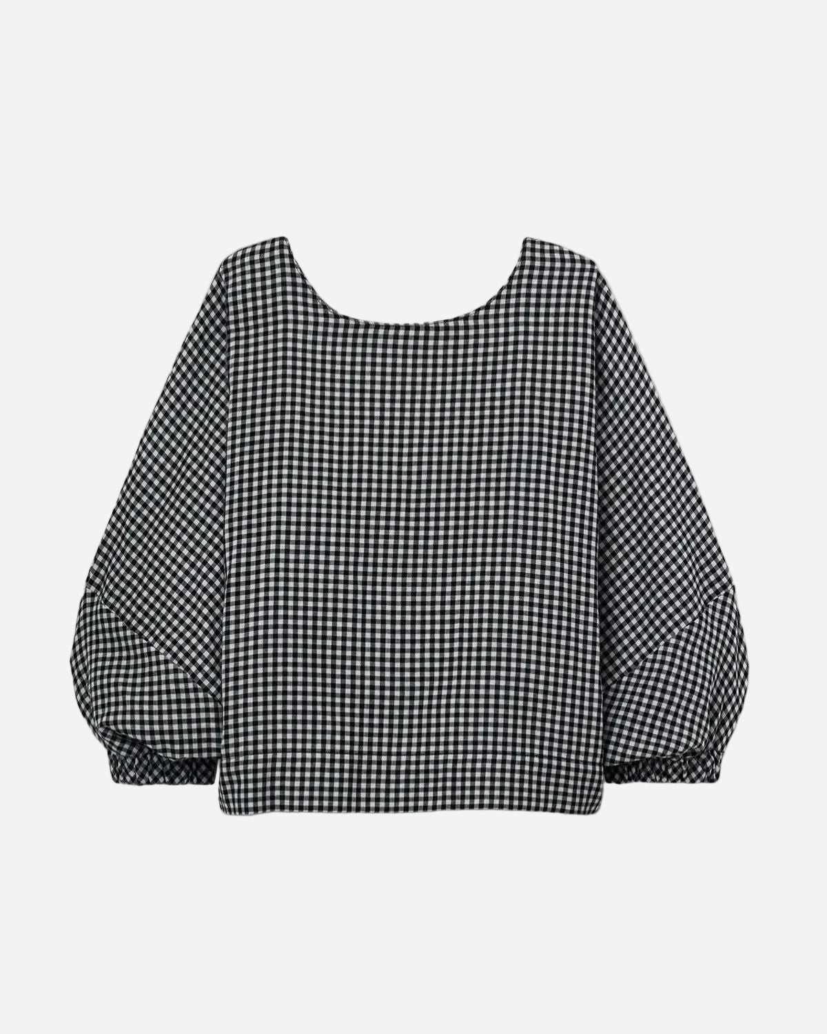 Black and white checkered blouse on a light gray background