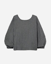 Black and white checkered blouse on a light gray background
