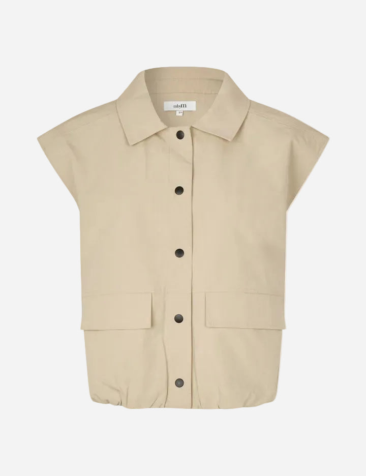 Beige sleeveless shirt with button details on a white background