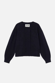 A dark navy blue knit cardigan sweater with a ribbed front panel and long sleeves, laid flat against a light cream background.  