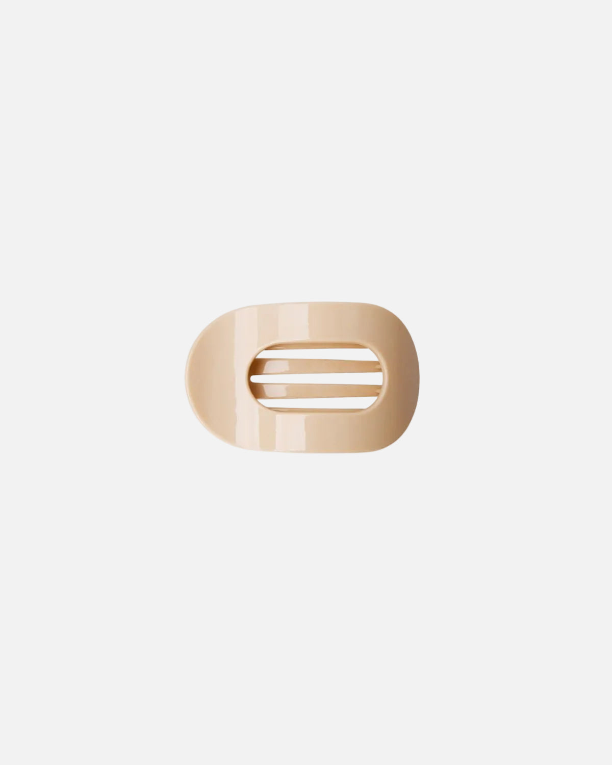 A small beige oval hair clip with a horizontal slit design, shown on a plain white background.