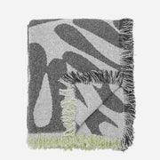 Green and white patterned throw