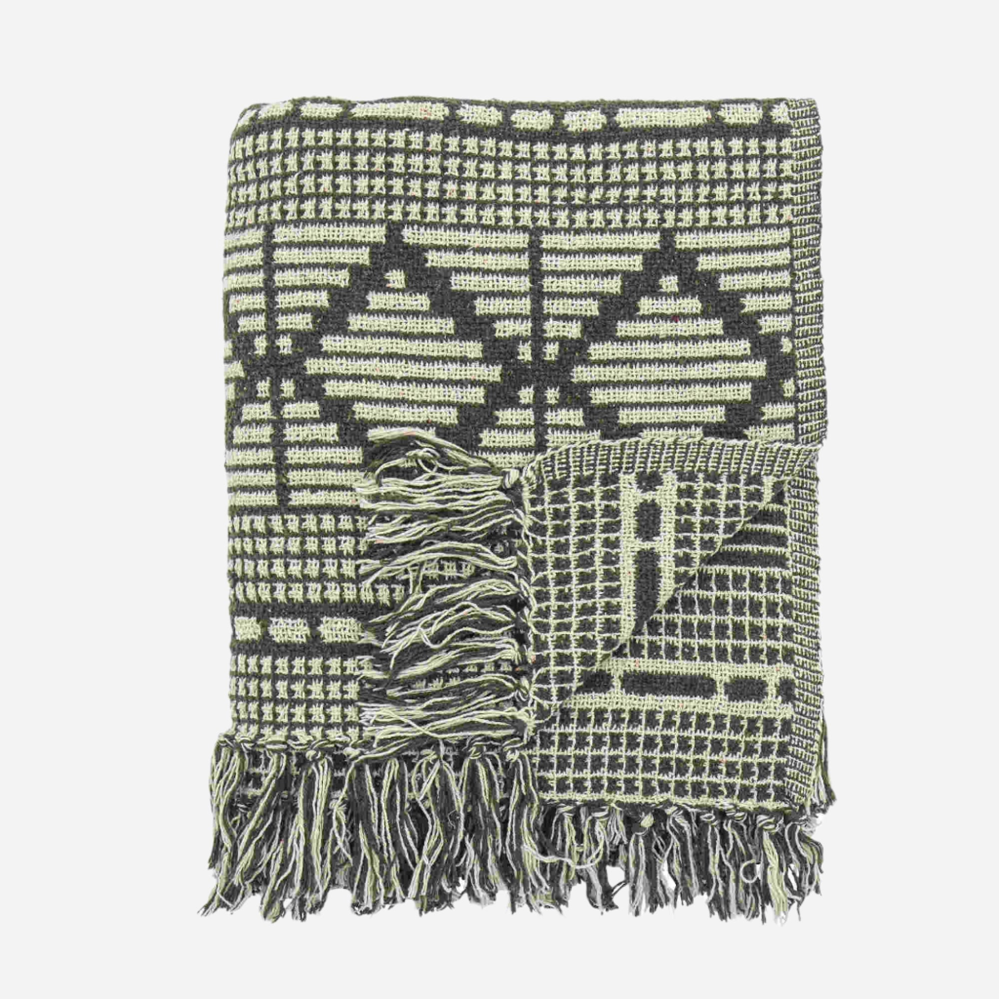 Green patterned throw with tassles