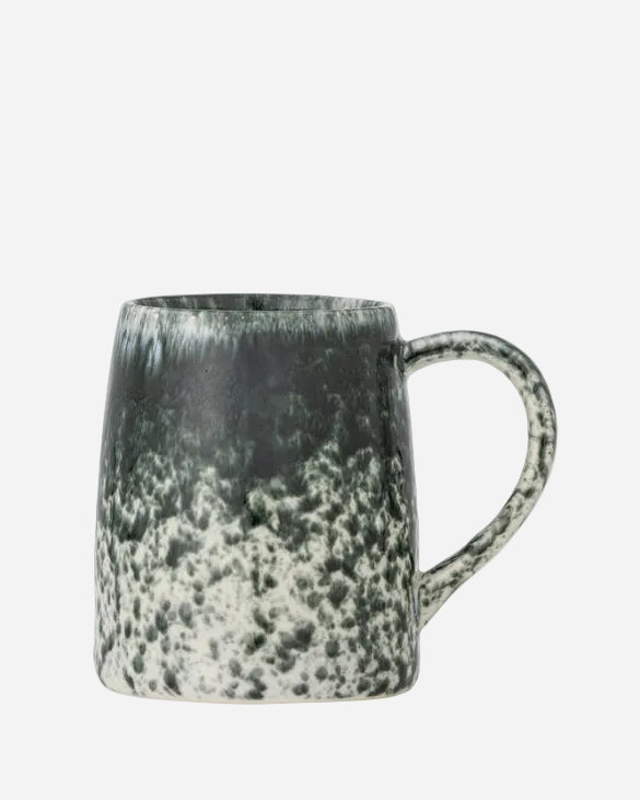 black and white speckled mug on a white background