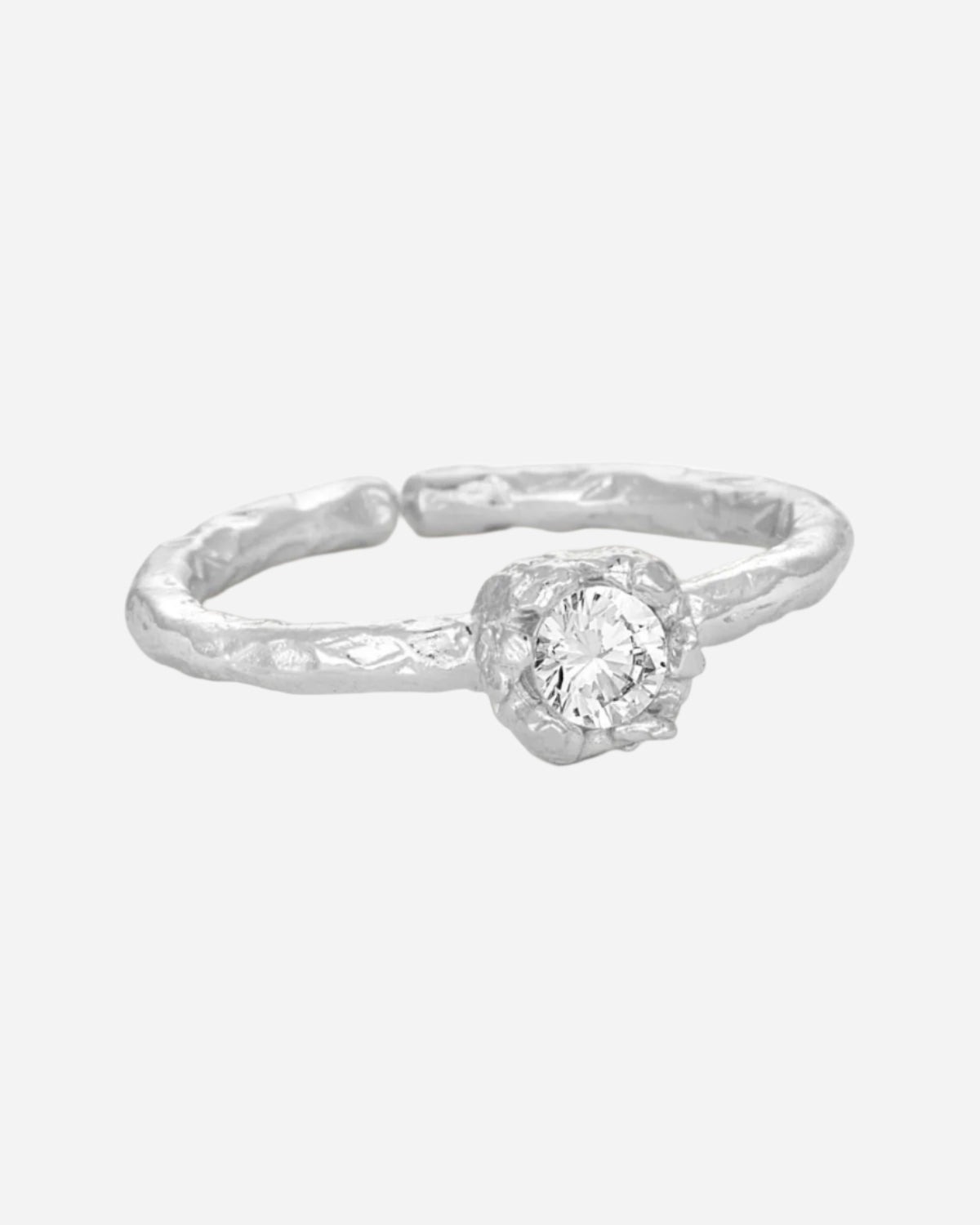 Silver ring with gemstone on a white background