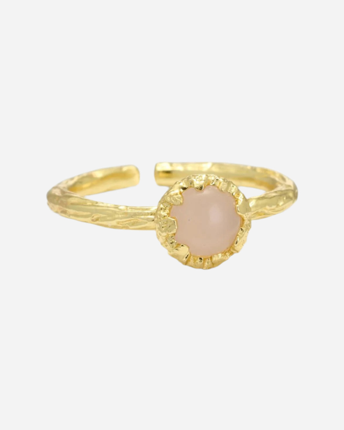Gold ring with a rose quartz stone on a white background