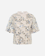 Floral sequin top on a white background