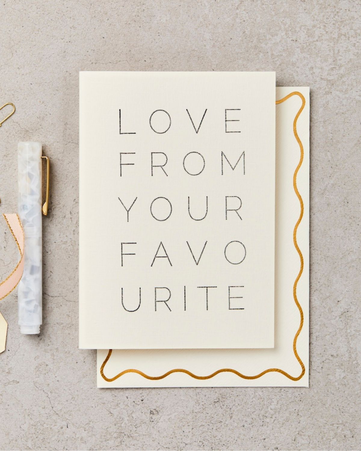 Card with 'Love from your favourite' text on a textured surface
