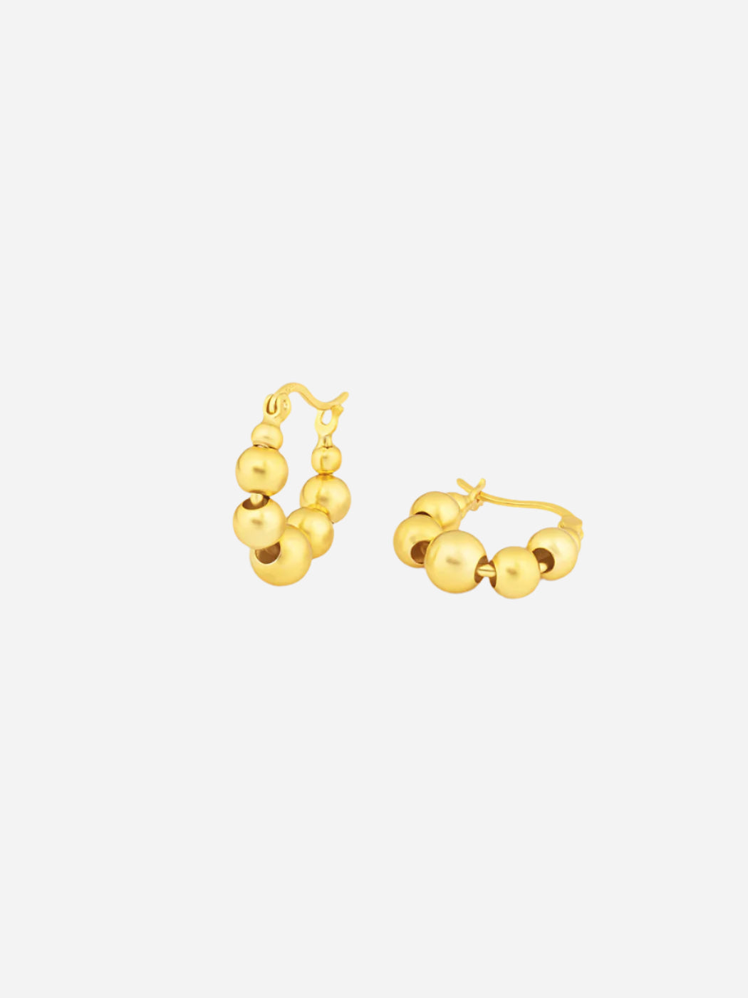 Pair of gold hoop earrings on a white background