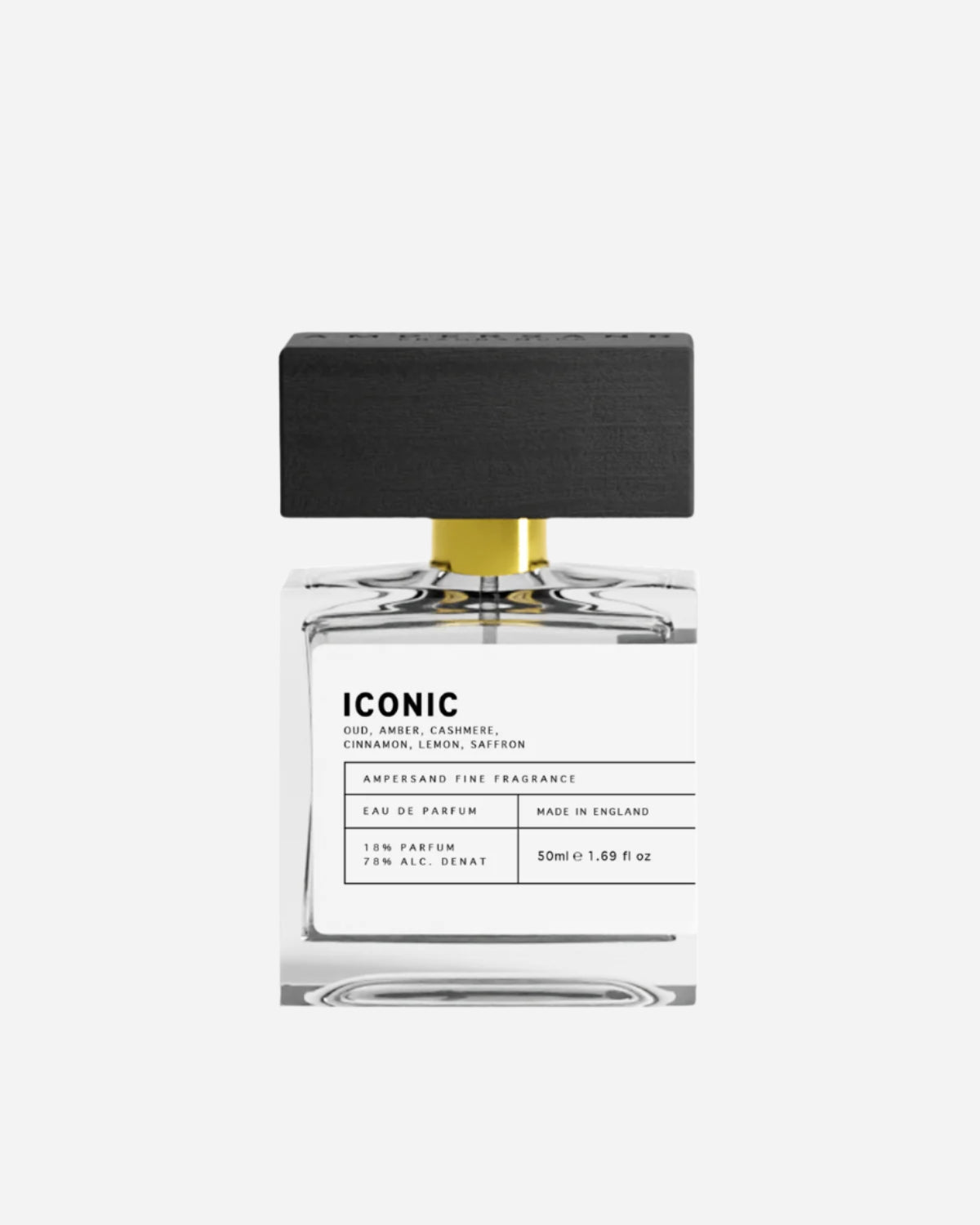 Clear perfume bottle with black and white printed label and black wooden cap with Ampersand engraving.
