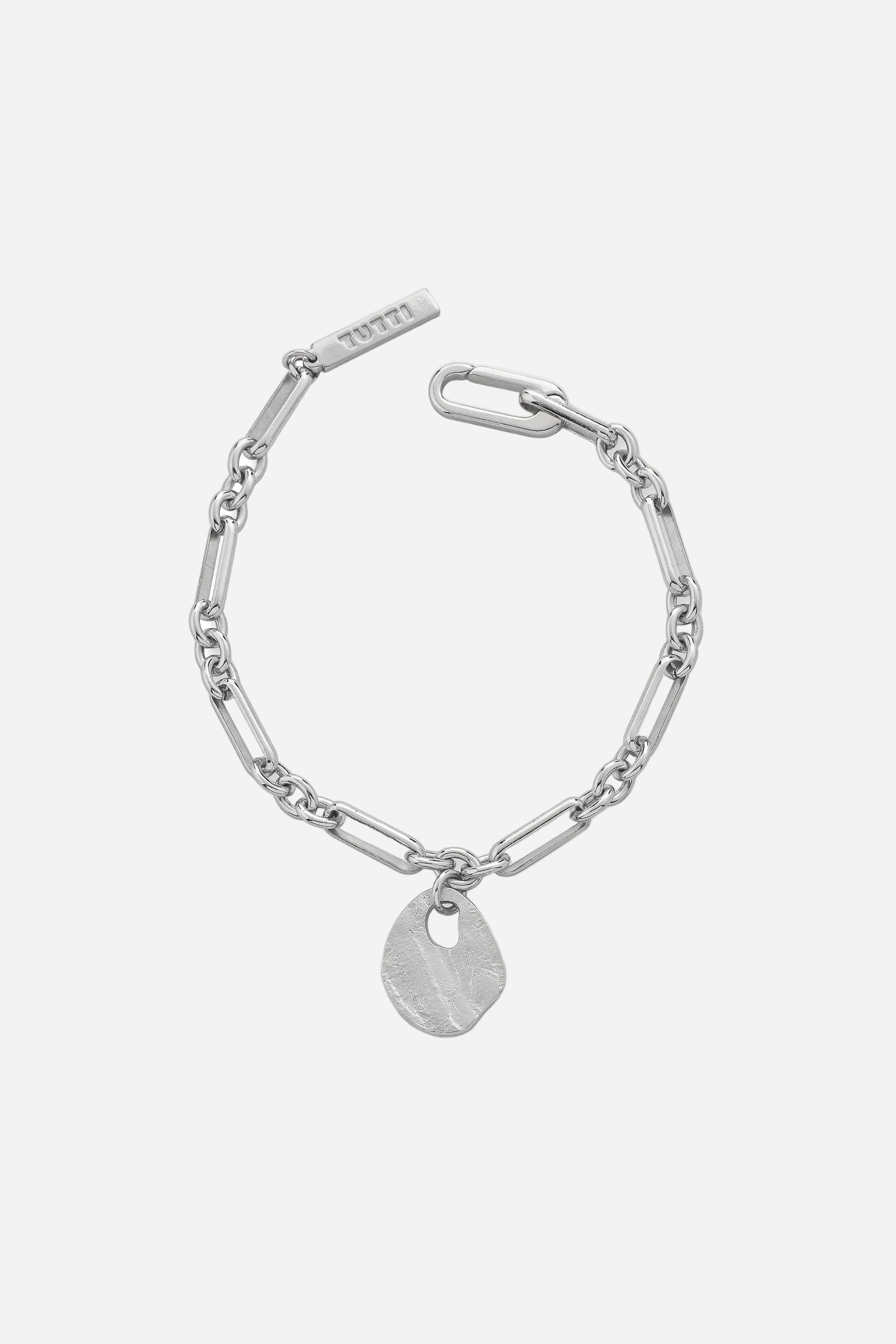 Silver bracelet with a tag on a white background