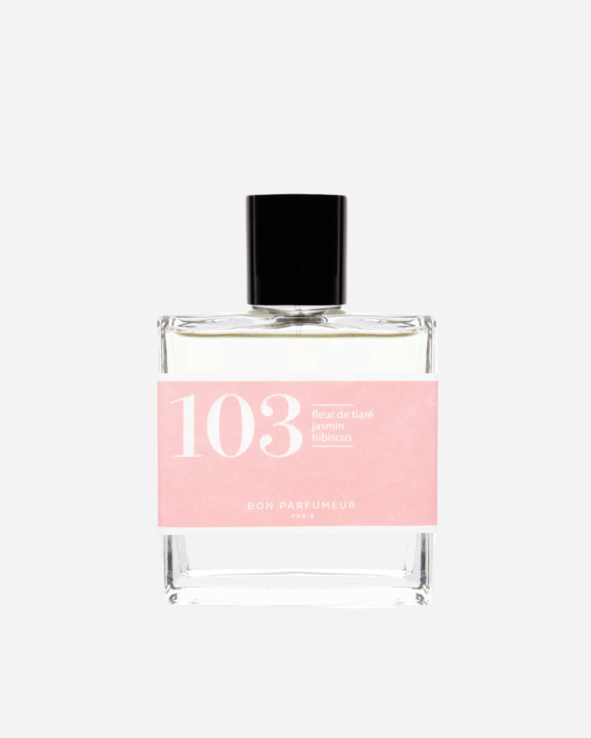 Clear square perfume bottle with black lid and pink label