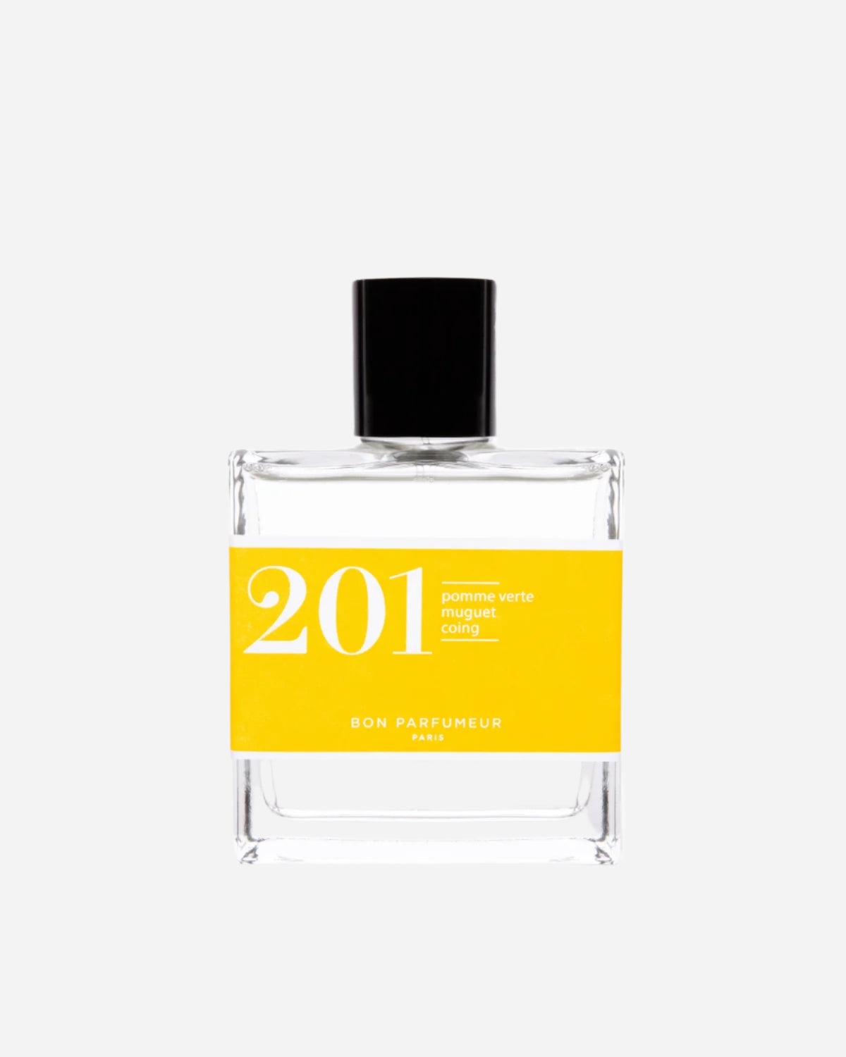 Clear square perfume bottle with black lid and yellow label