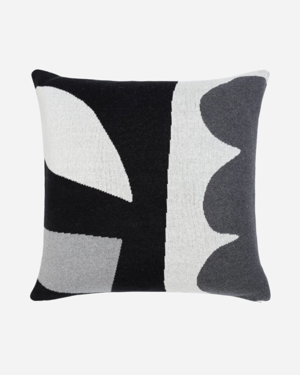 Decorative pillow with abstract black, gray, and white pattern on a white background