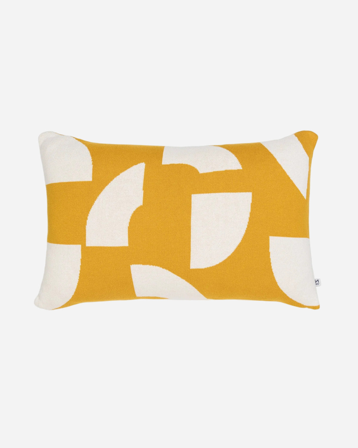 Yellow and white decorative pillow with abstract pattern on a white background