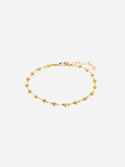 A gold-colored delicate chain bracelet with a dainty design, displayed against a white background.