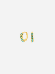 A pair of gold-colored huggie earrings adorned with turquoise stones.