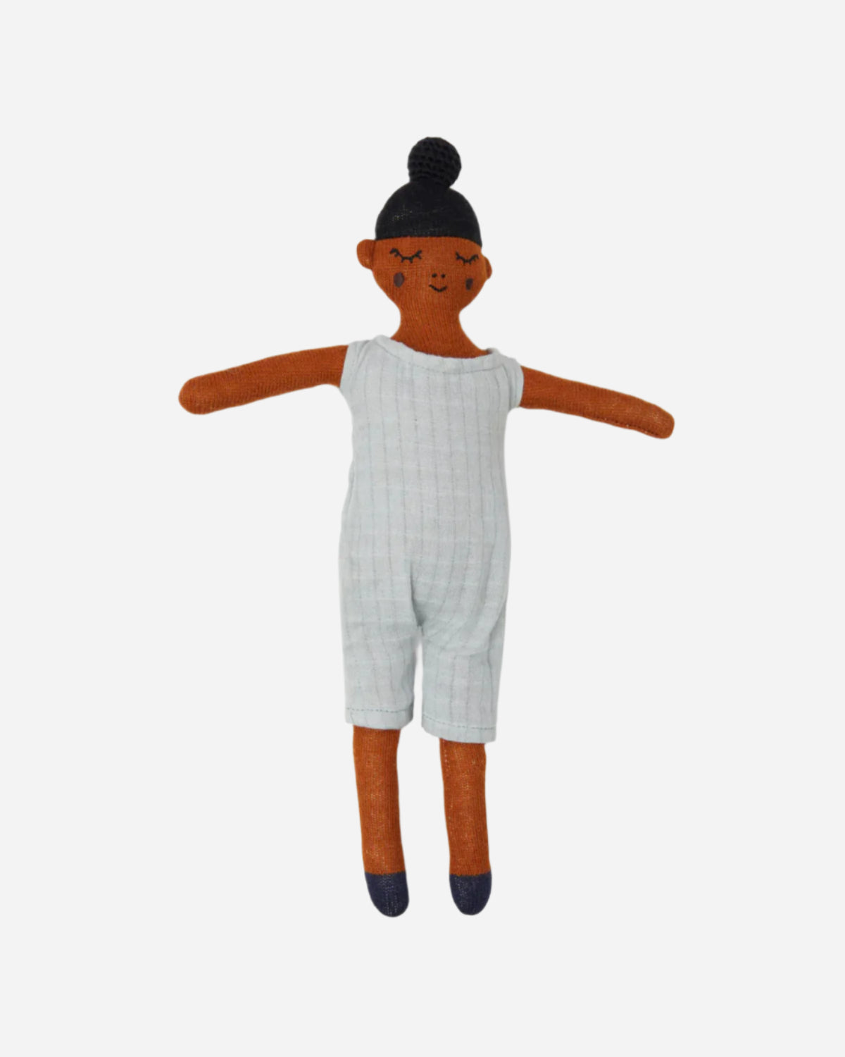 Doll with white outfit on a plain background