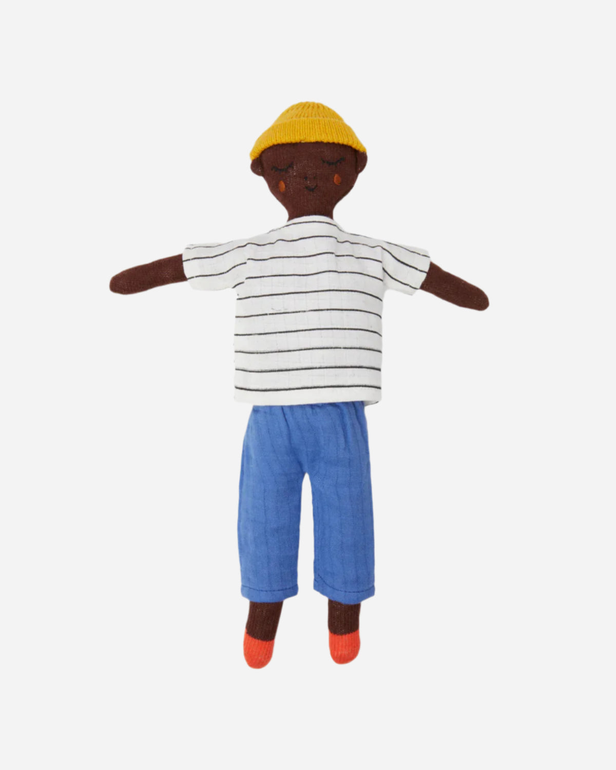 Plush toy of a child wearing a striped shirt, blue pants, and a yellow hat on a white background