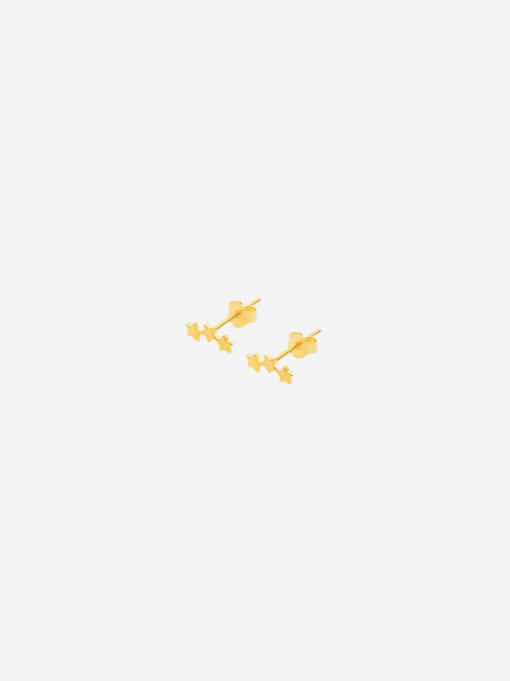 A pair of gold-colored star-shaped stud earrings on a white background