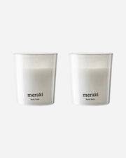 Two white scented candles in a minimalist design.