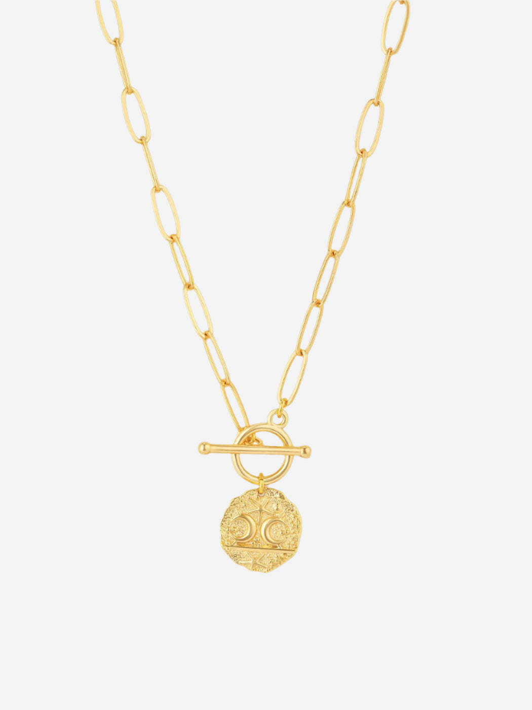 Gold necklace with a circular pendant on a white background