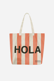 Striped tote bag with 'HOLA' text on a white background