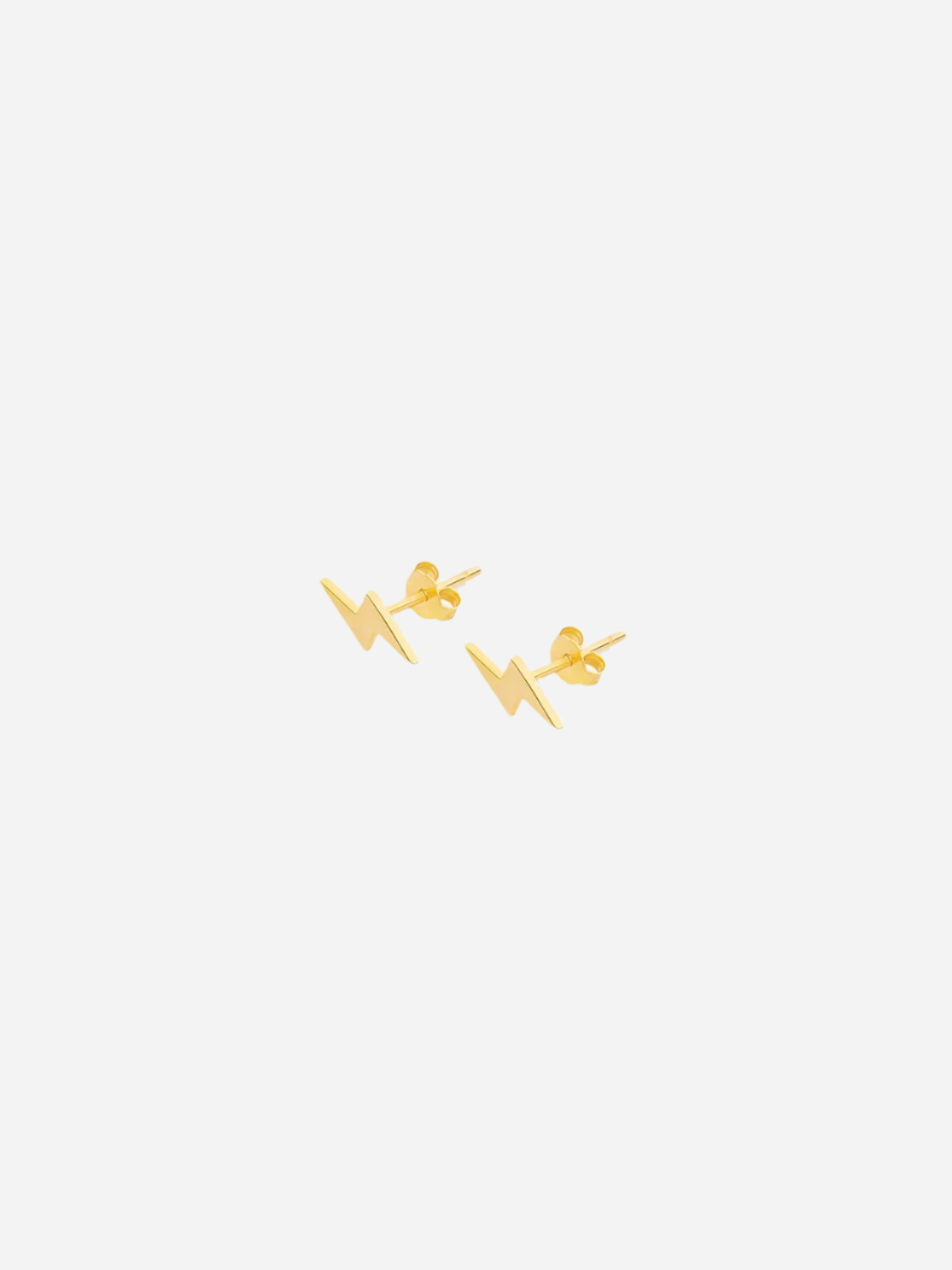 A pair of gold-colored mini lightning stud earrings against a white background.