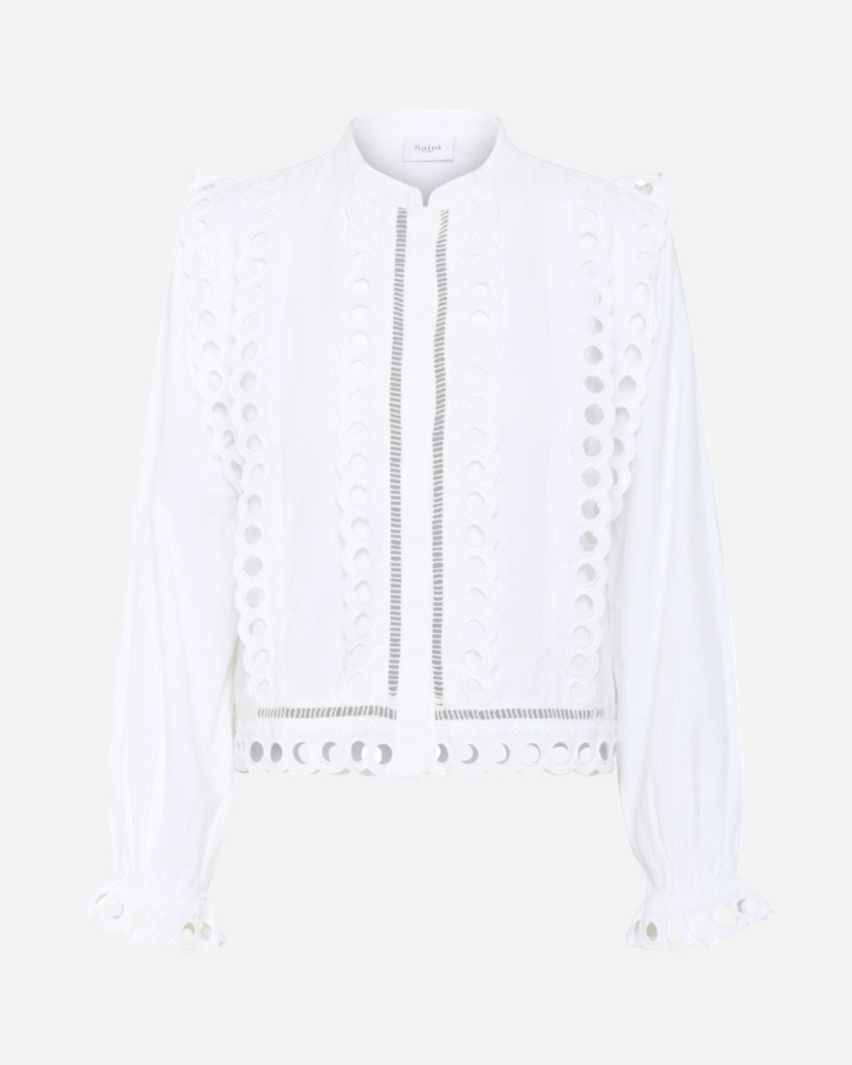 White blouse with decorative elements on a white background