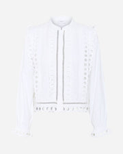 White blouse with decorative elements on a white background