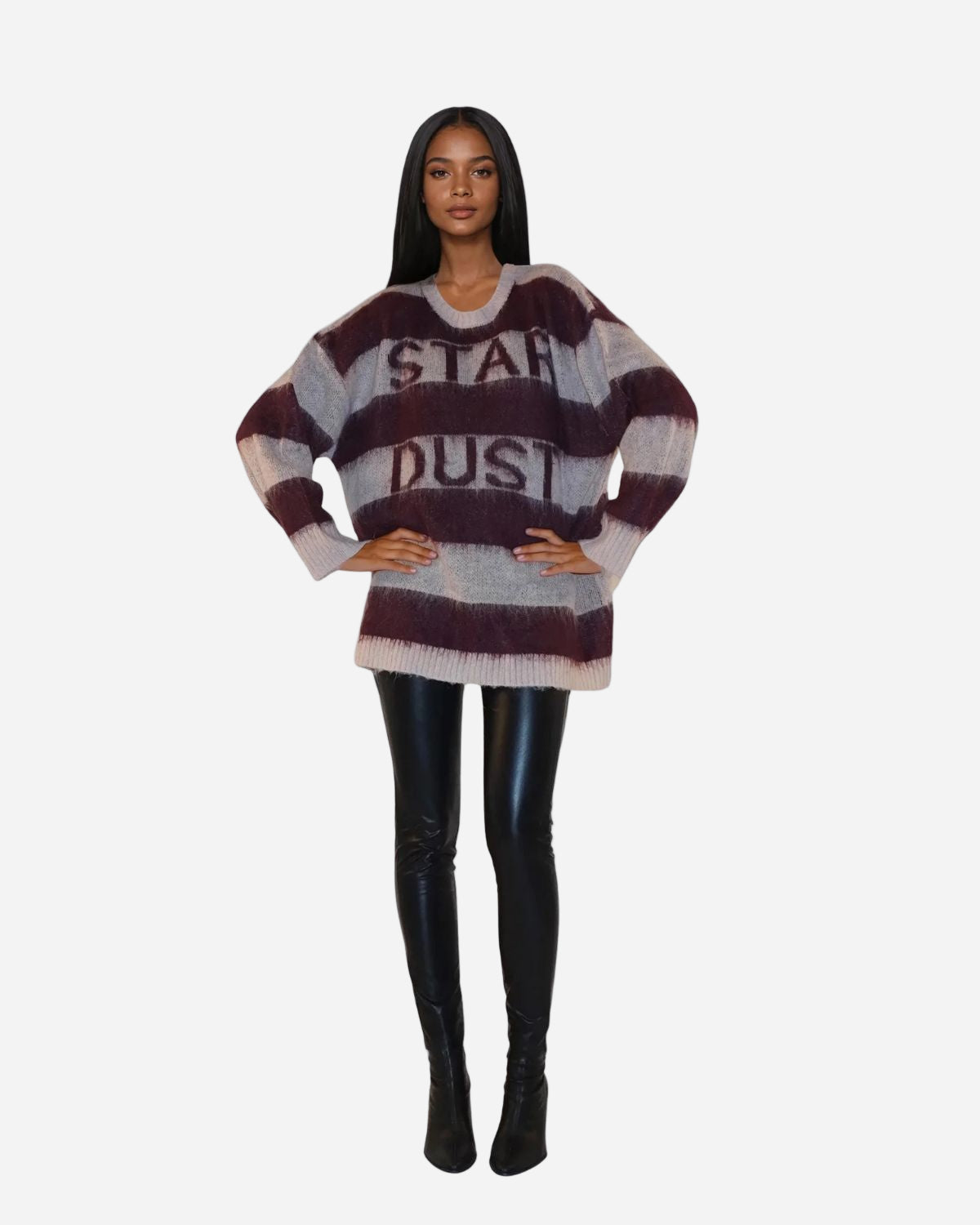 Person wearing a striped sweater with text on a white background