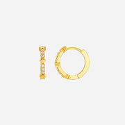 Gold hoop earrings with small diamonds on a white background