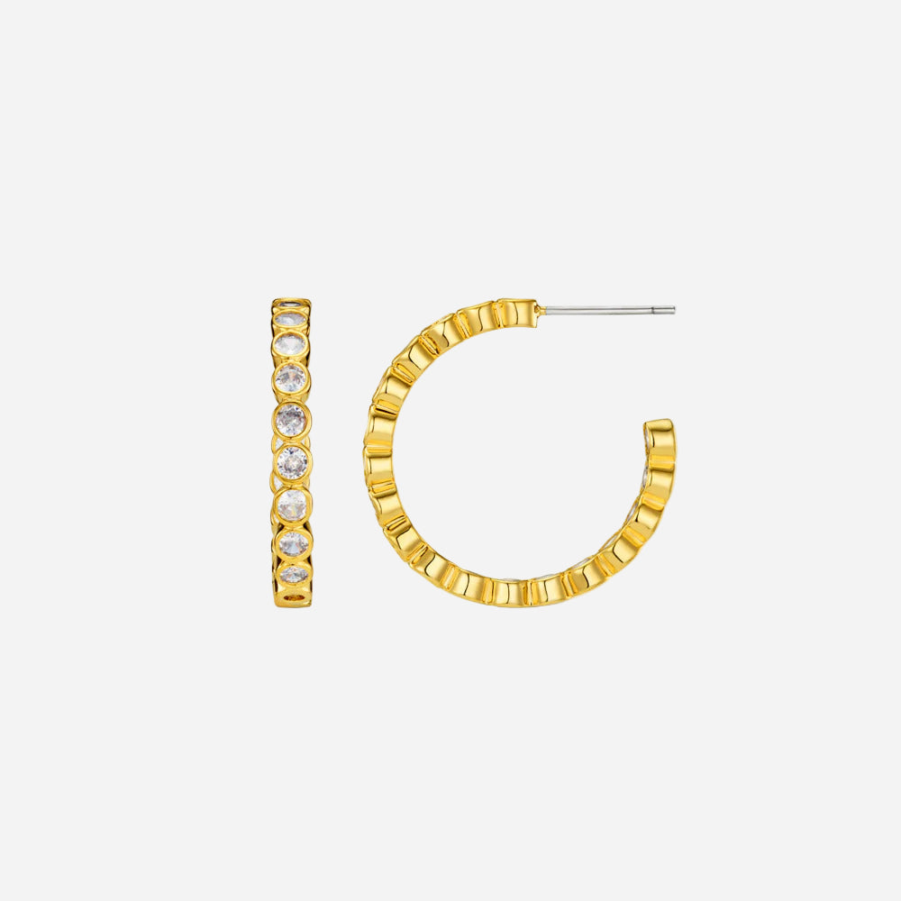 Gold hoop earrings with embedded stones on a white background