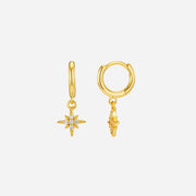 Gold hoop earrings with star-shaped charms on a white background