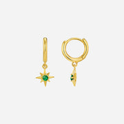 Gold hoop earrings with star-shaped and round green gemstones on a white background