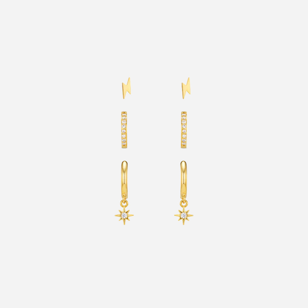 Gold earrings with star designs on a white background