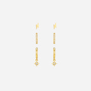 Gold earrings with star designs on a white background