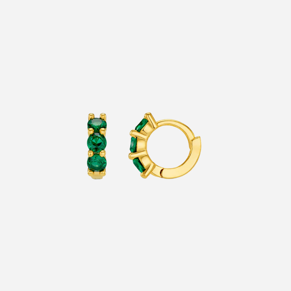 Gold hoop earrings with green gemstones on a white background