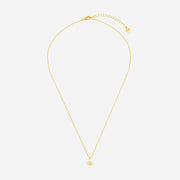 Gold necklace with a small star pendant on a white background