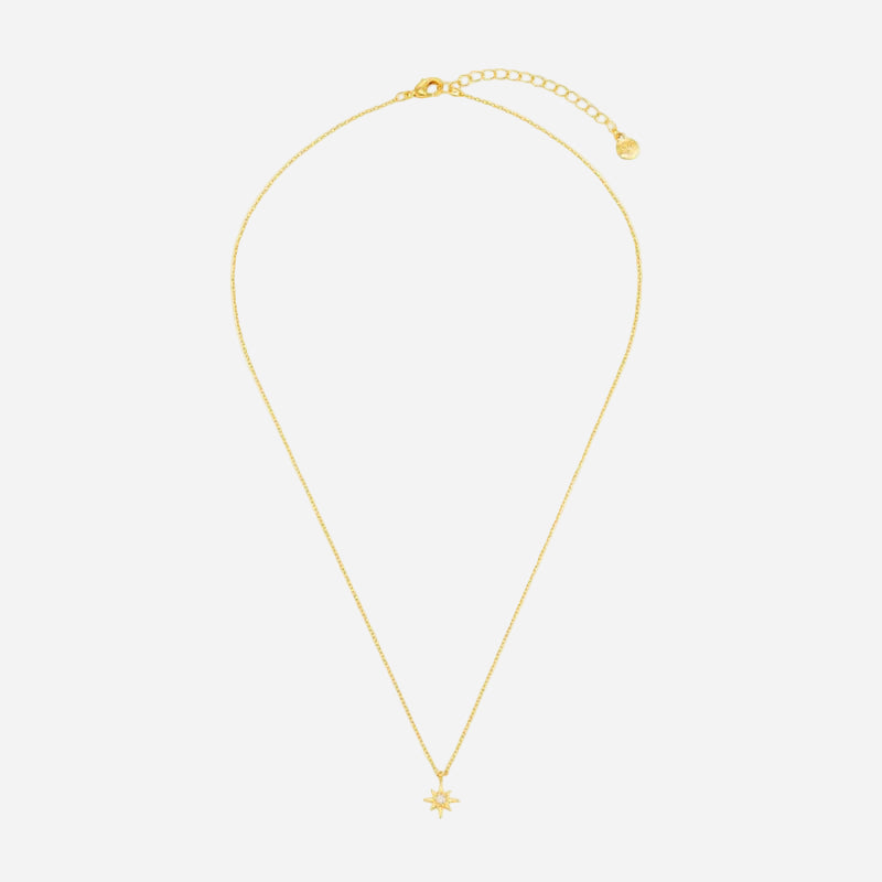 Gold necklace with a small star pendant on a white background