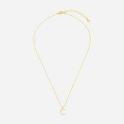 Gold necklace with a small crescent moon pendant on a white background