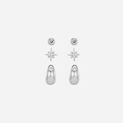 Set of silver earrings including star-shaped and teardrop-shaped designs on a white background