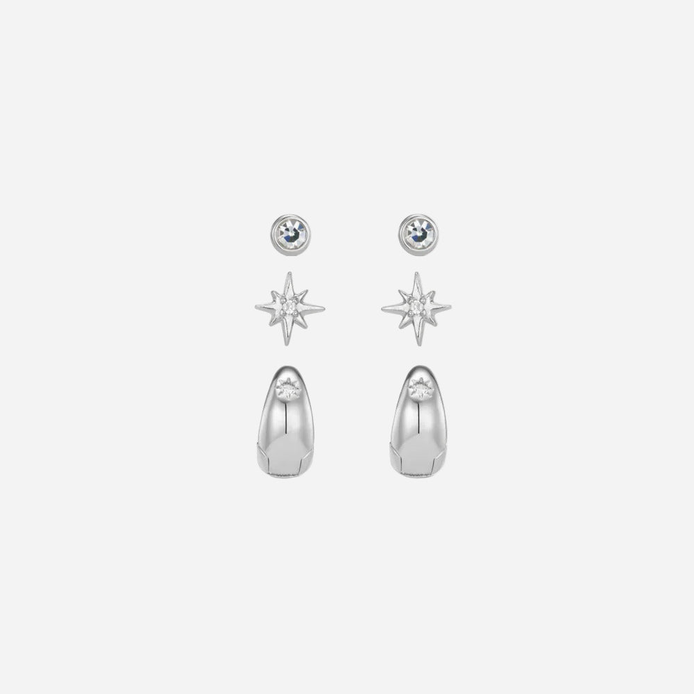 Set of silver earrings including star-shaped and teardrop-shaped designs on a white background