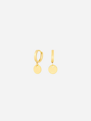 A pair of gold huggie earrings with two shiny circular disc charms attached to the hoop.
