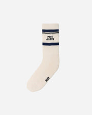 White sports sock with navy stripes and PEAS & LOVE phrase